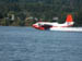 Firefighting seaplane picking up sea water