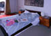 08 kingsized but  low bed,, zebras and two bedside cabinets