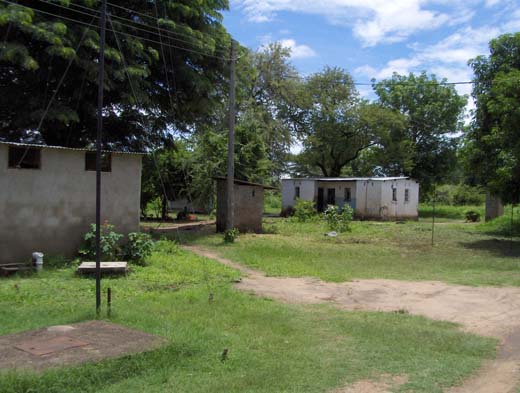 Staff hovel, pit latrines and non-functioning wc's