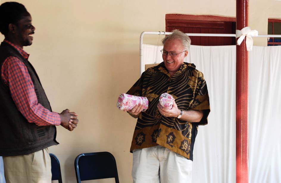 19 Chairman Zulu makes a presentation to Grant and Johnny from the Clinic