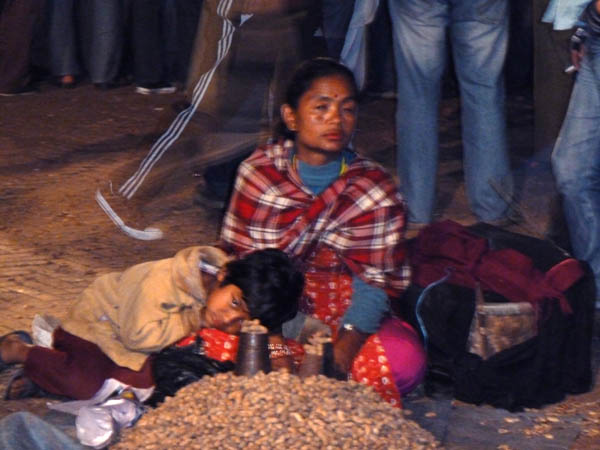 10 Peanut seller and her son in Patan Durbar Square