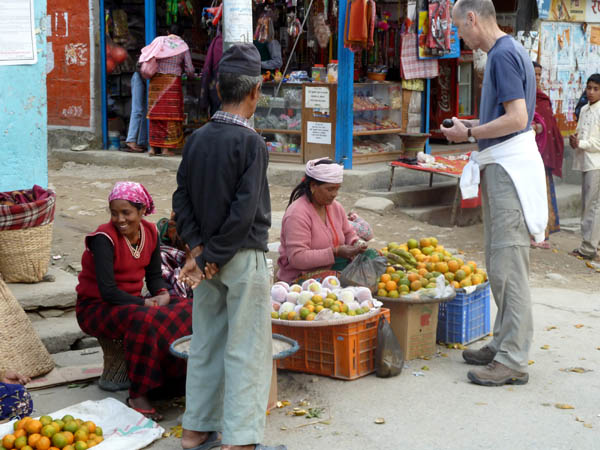 14 Johnny buying oranges prior to our trek in the Besisahar market
