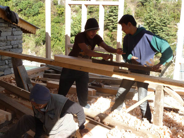 10 Two Nepalese joiners making a house by hand with traditional tools