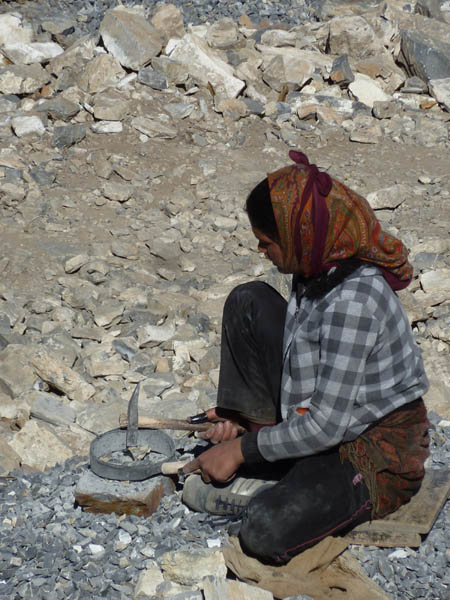 18 One of many women (and men) breaking stones for making concrete