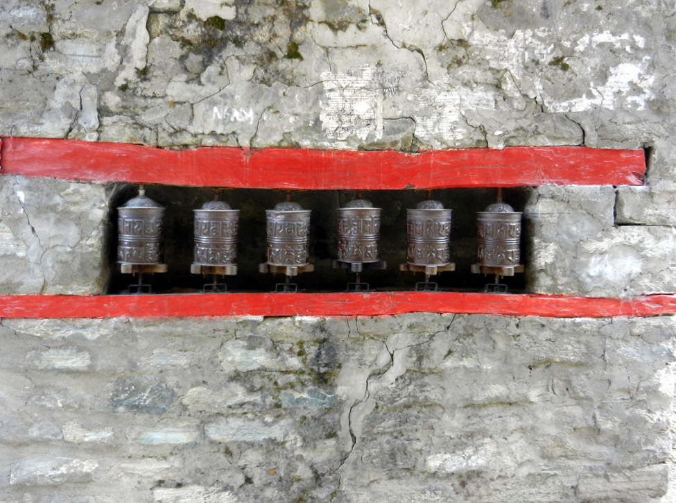 10 Prayer wheels in Chame gate