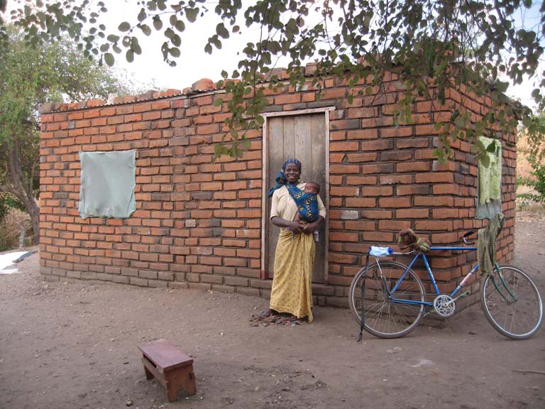 02 James Chulu's house, bicycle, wife and second born